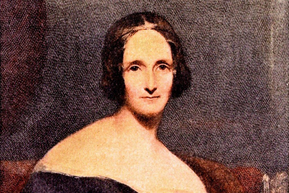 A colourised portrait of Mary Shelley. She has very short, bobbed hair and is wearing a black dress with bare shoulders.