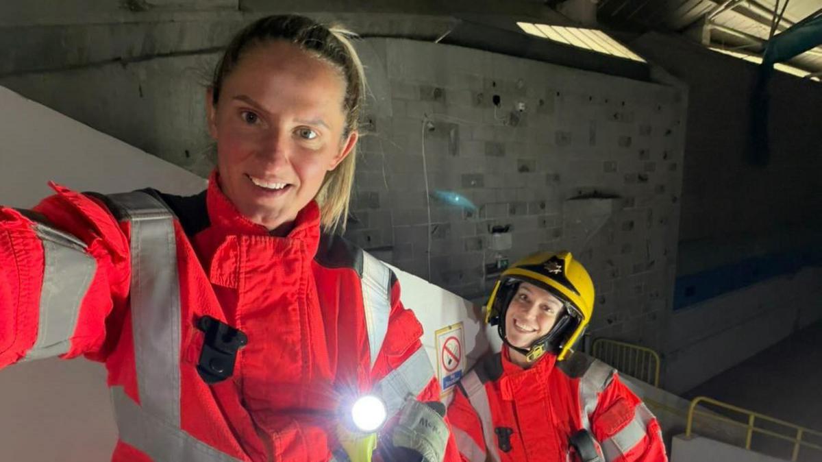 Abbie McManus in her firefighter uniform alongside a colleague during firefighter training. 