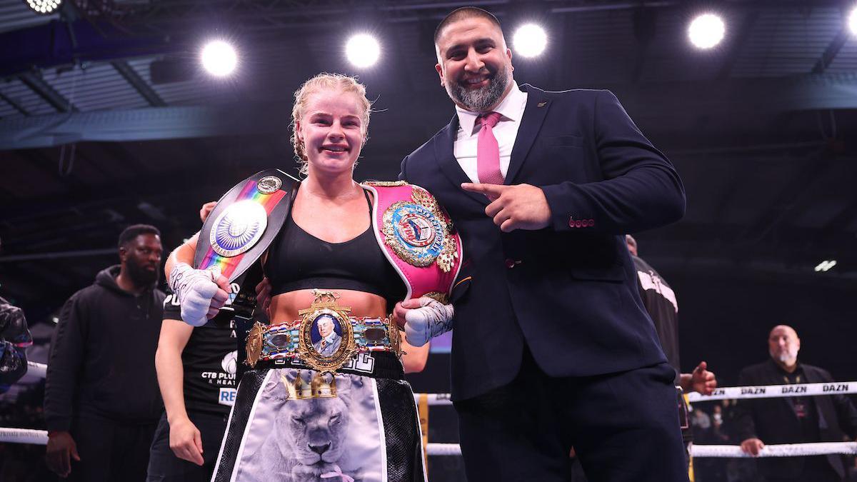 Izzy Asif in the ring with boxer Tysie Gallagher 