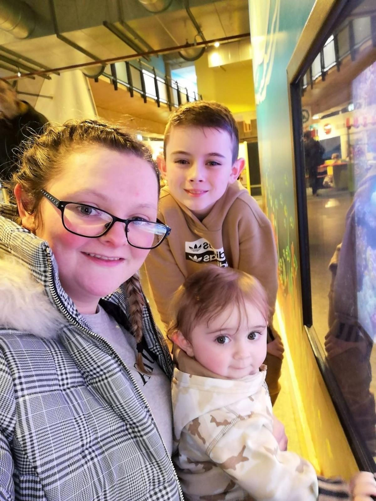 Dylan with his mum and baby sister