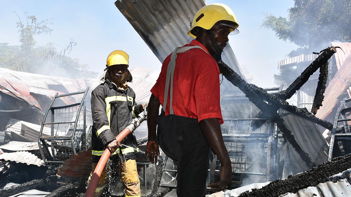 Fire officers dampen down at Kisumu Boys High School, Kisumu - January 2021