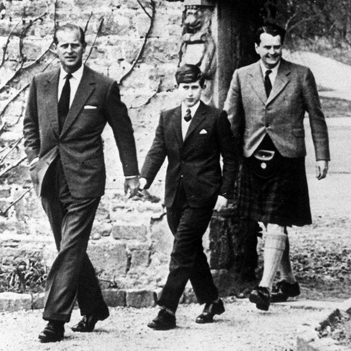 File photo dated 01/05/62 of the Prince of Wales, with his father the Duke of Edinburgh (left) and Captain Iain Tennant, Chairman of the Gordonstoun Board of Governors, arriving at Gordonstoun for the Prince's first day at Pulic School.