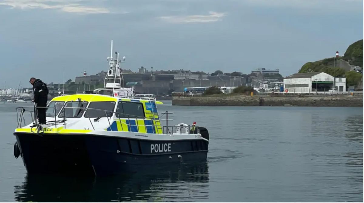 The police vessel Neptune is patrolling a harbour in Dorset