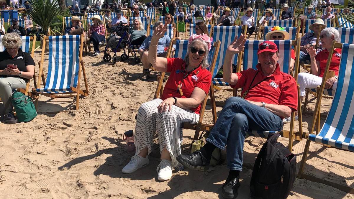 Visitors to RHS Malvern Spring Festival enjoy the makeshift beach