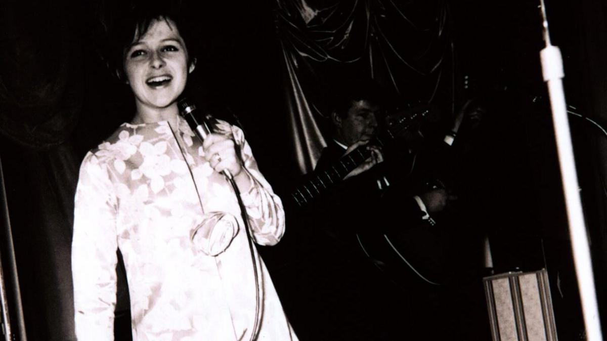 Black and white photo of Brenda Lee performing at the Gliderdrome in Boston