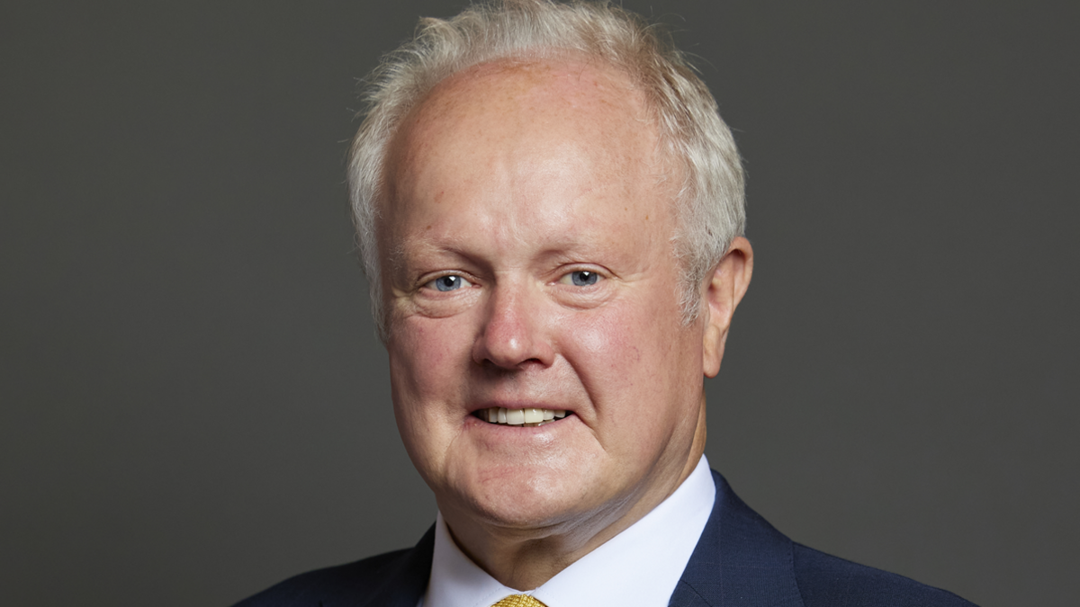 The Parliamentary portrait of Clive Jones, who has short, white hair.