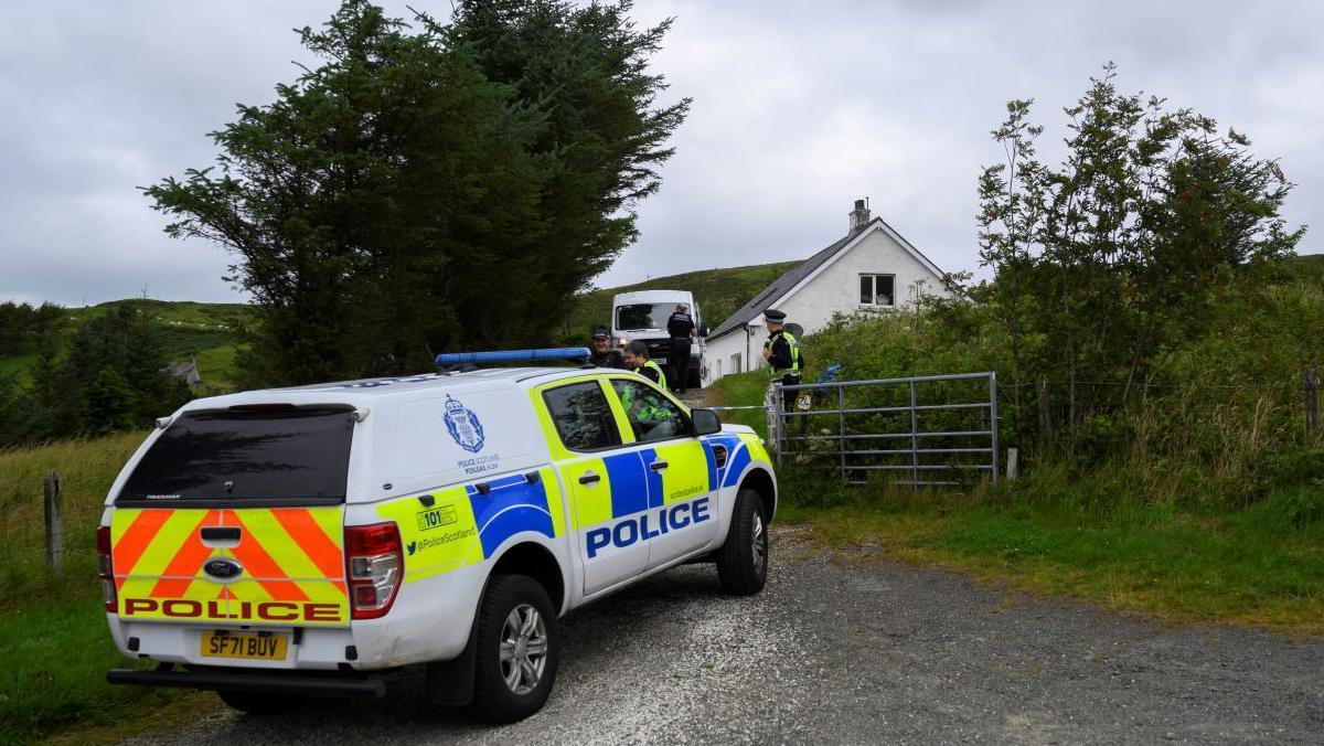 Police outside the MacDonalds' home