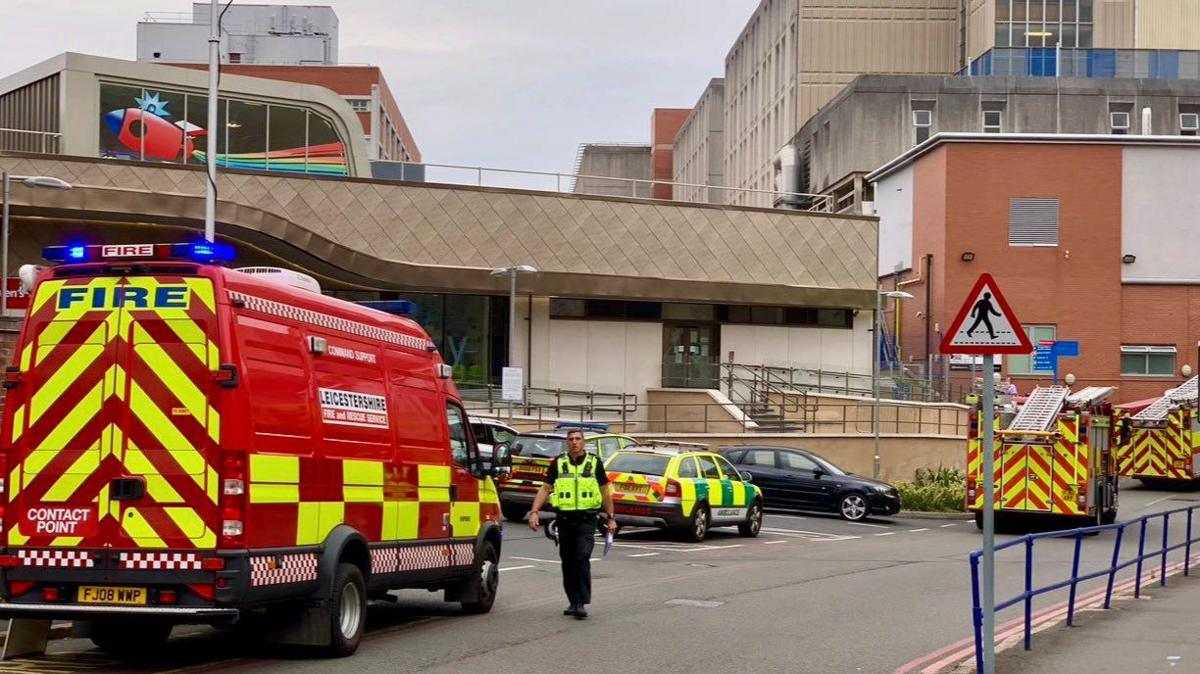 Two fire engines and a contact point fire van outside Leicester Royal Infirmary.