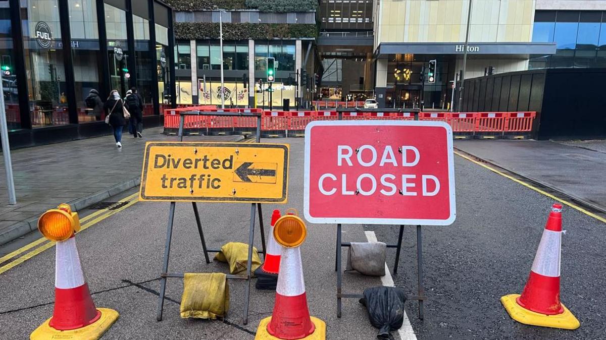 Road closure and diversion signs at Victoria Way in Woking