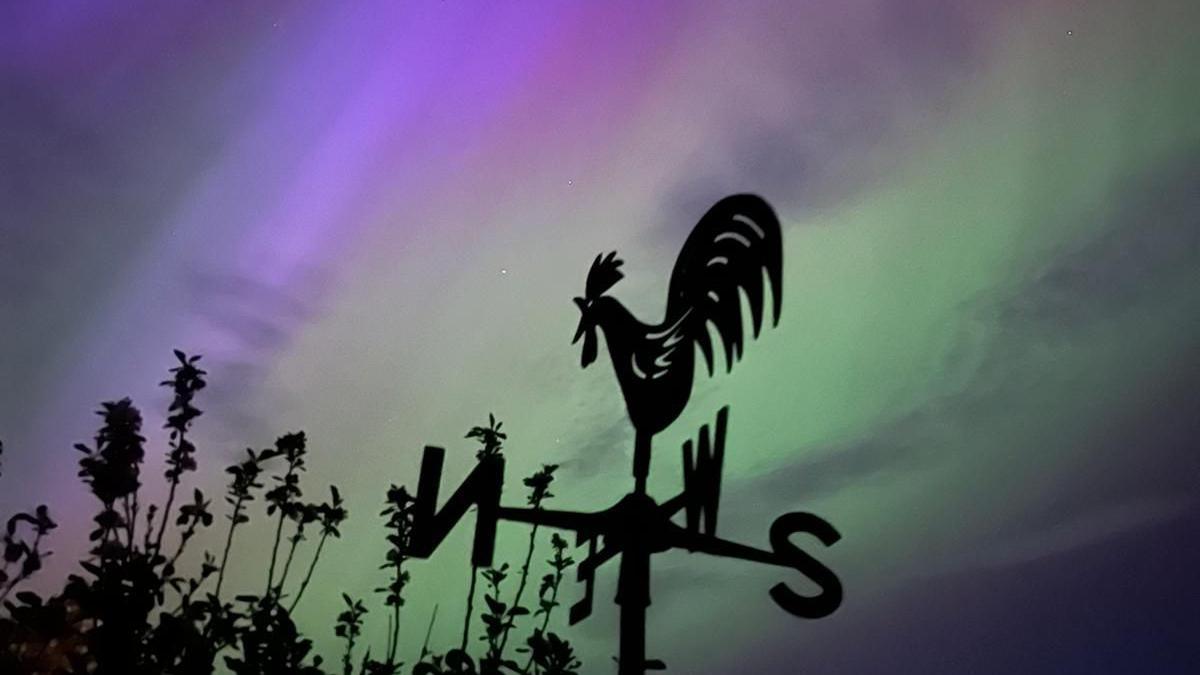 Northern Lights behind weathervane