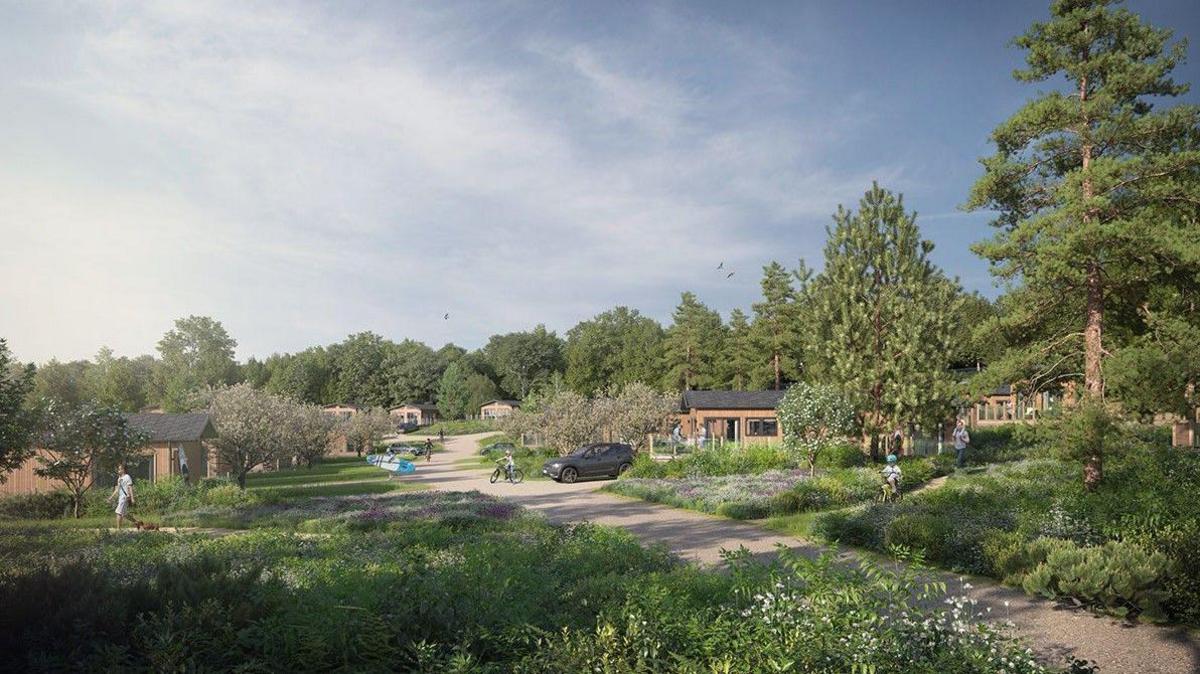 An artist impression of a new holiday park which is located in a wooded area. People in the picture can be seen walking and cycling and there are a number of holiday lodges visible in between trees.