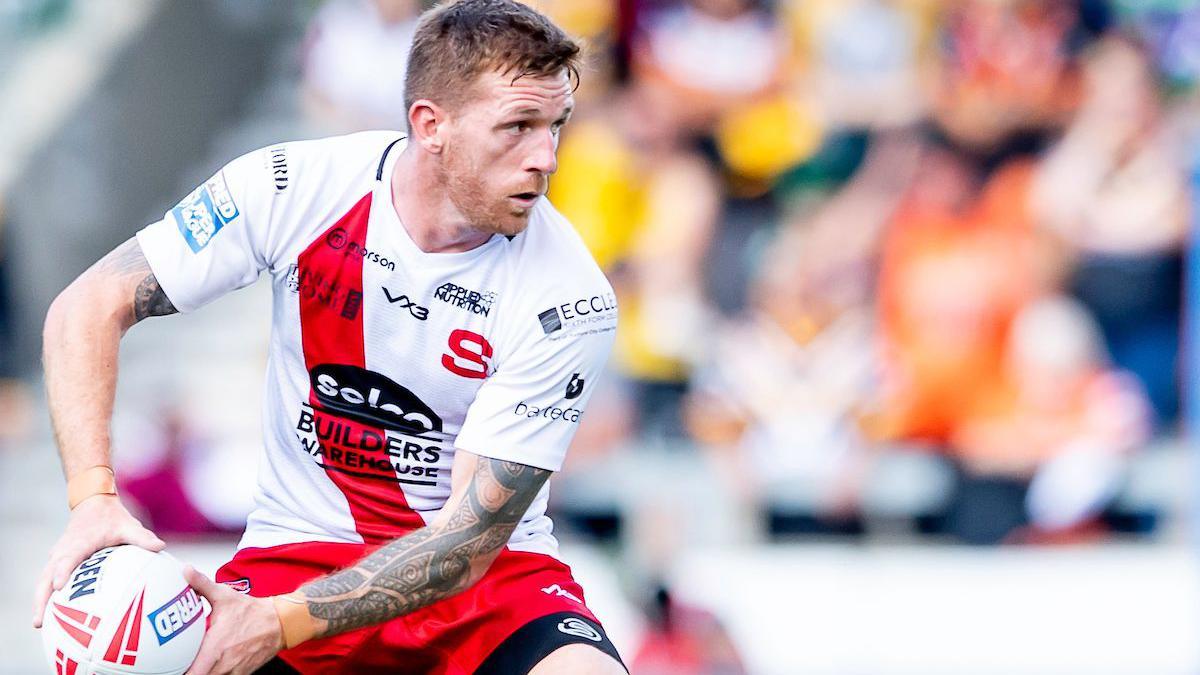 Marc Sneyd with ball in hand for Salford Red Devils