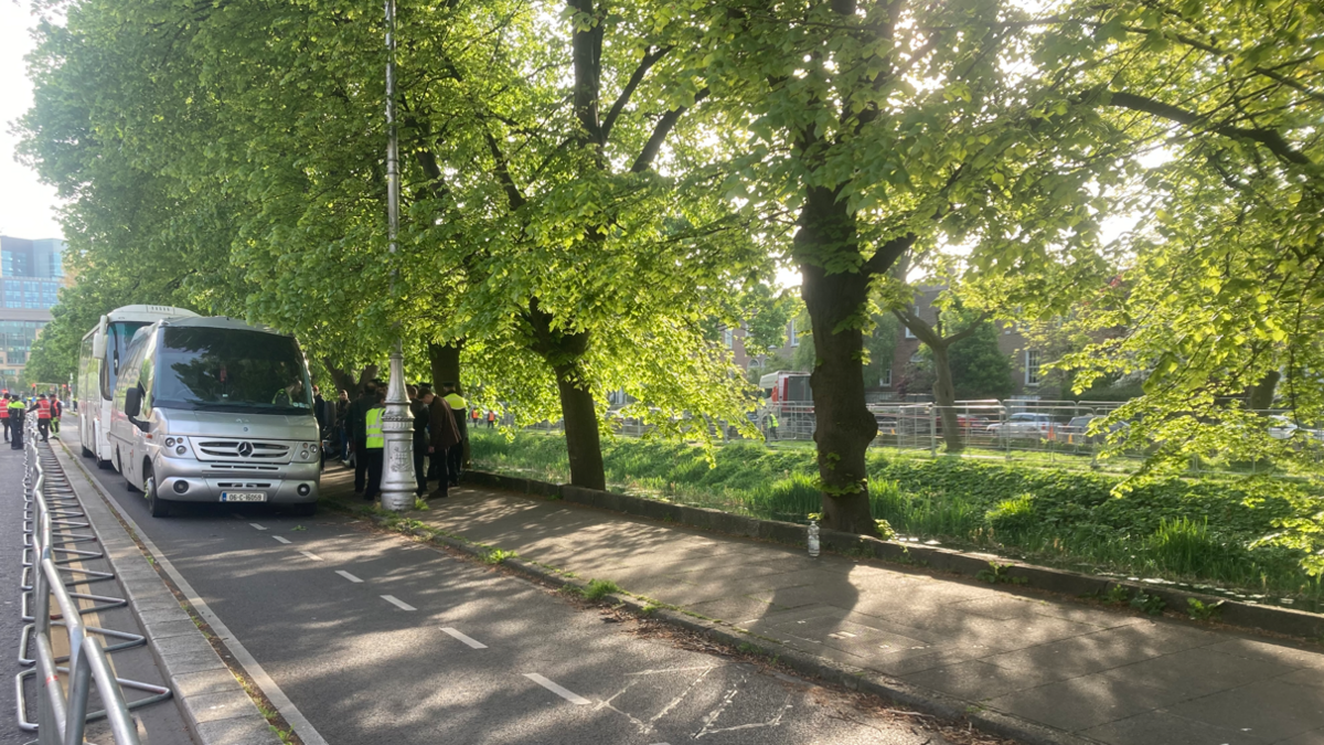 Buses arrive to transport asylum seekers at the Grand Canal