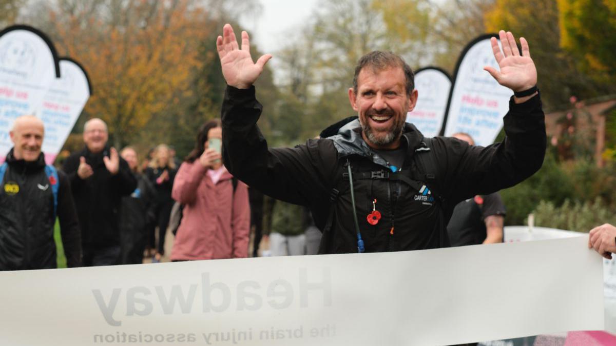 Traitors star Andrew Jenkins at finish line of his Scotland to Wales walk