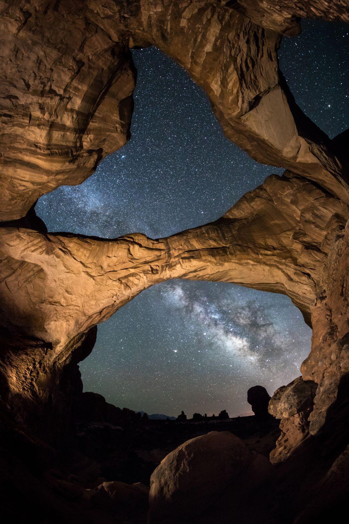 The Milky Way seen through arches of rock