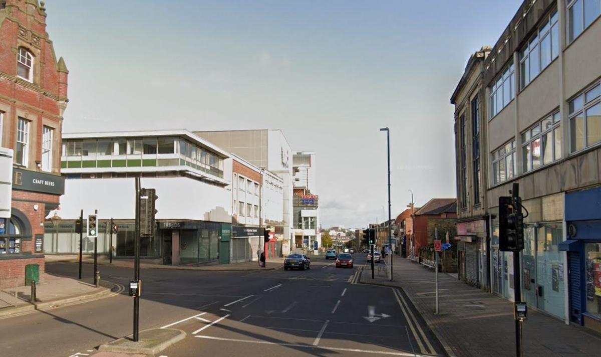 Gateshead High Street in 2023, with some traffic and empty shops