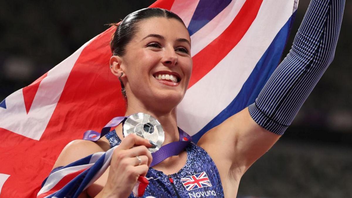 Amy Hunt celebrates after winning world 200m silver in Tokyo in September
