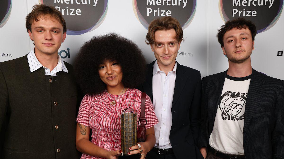 Members of the band English Teacher line-up holding their Mercury Prize award for the best album of 2024 after the ceremony at Abbey Road Studios, London