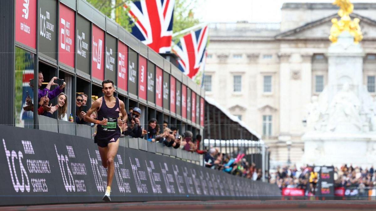 Britain's Emile Cairess in action before crossing the line to finish third in the men's elite race