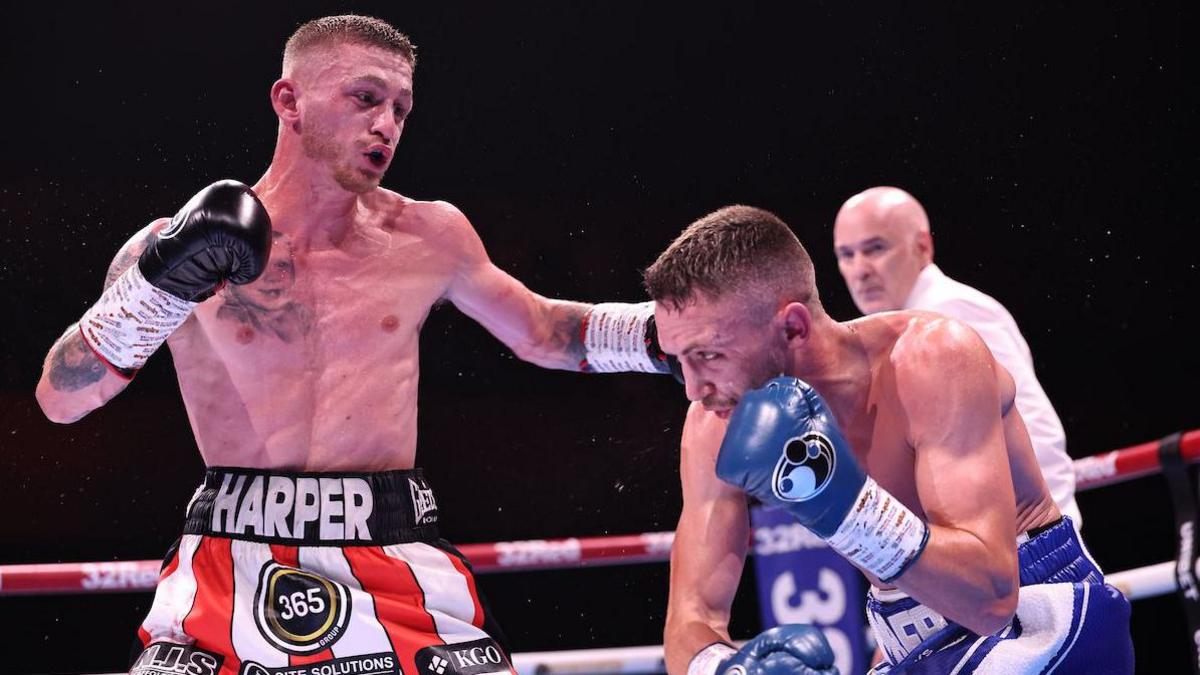 Ryan Garner throws a punch at his opponent Reece Bellotti during their fight