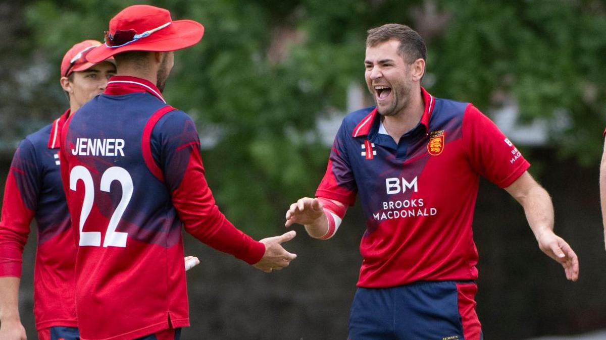 Charles Perchard celebrates a wicket