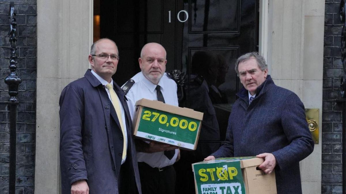 National Farmers' Union (NFU) president Tom Bradshaw (left) and NFU Cymru president Aled Jones (right) handing in a petition at 10 Downing Street, central London, over the changes to inheritance tax (IHT) rules in the recent budget which introduce new taxes on farms worth more than £1 million. Picture date: Friday January 24, 2025.
