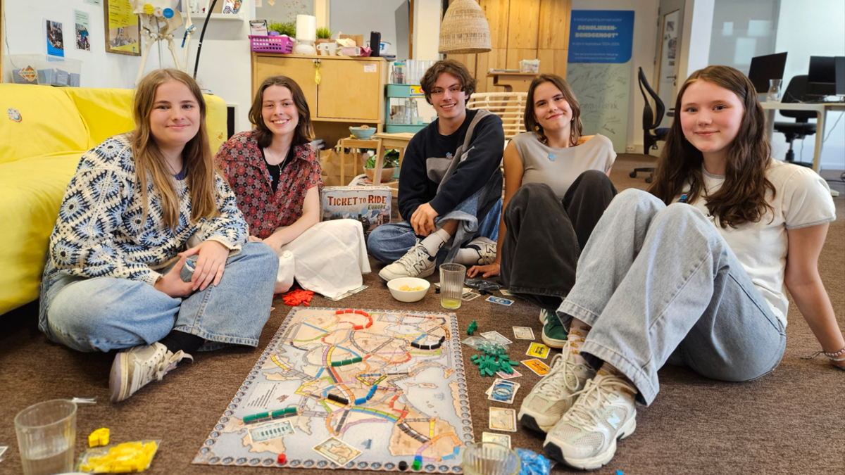 Friends in Belgium playing a board game