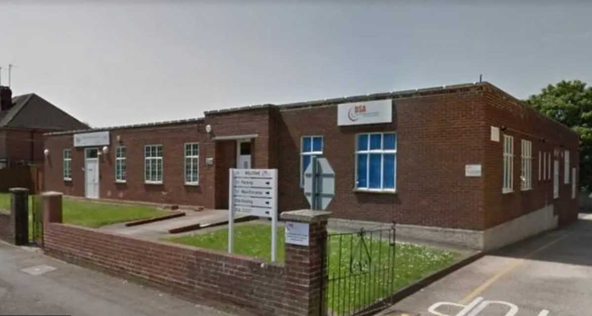 The Reading Driving Test Centre is a red brick building on one storey.