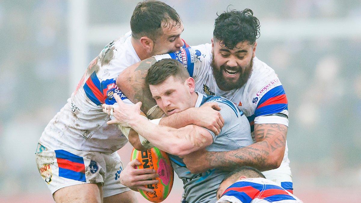 Anthony England and David Fifita make a tackle on Lee Gaskell