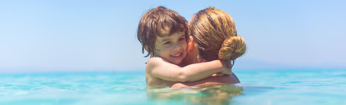 Mother and son in the sea