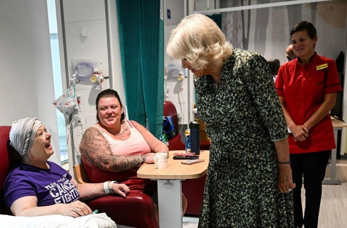 Queen Camilla talks to two cancer patients at the new Dyson Cancer Centre in Bath