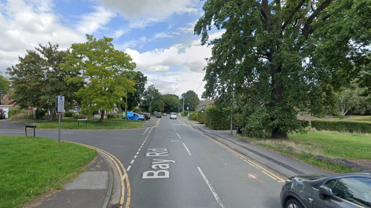 A screenshot from Google street view showing the approximate location of the crash. It's a T-junction on a residential street with grass and trees by the sides of the roads.