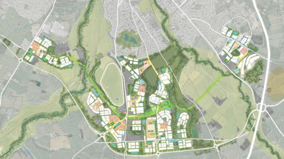 An aerial map of the garden village development which shows housing plots and fields.