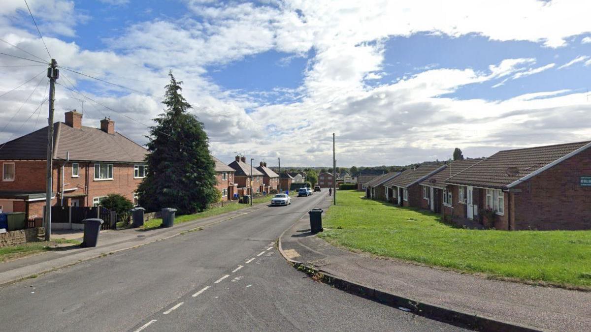 A Google street view of Kingsley Avenue,in Chesterfield. On the right are a row of houses and on the left are a row of bungalows. There are bins out on the pavement. 