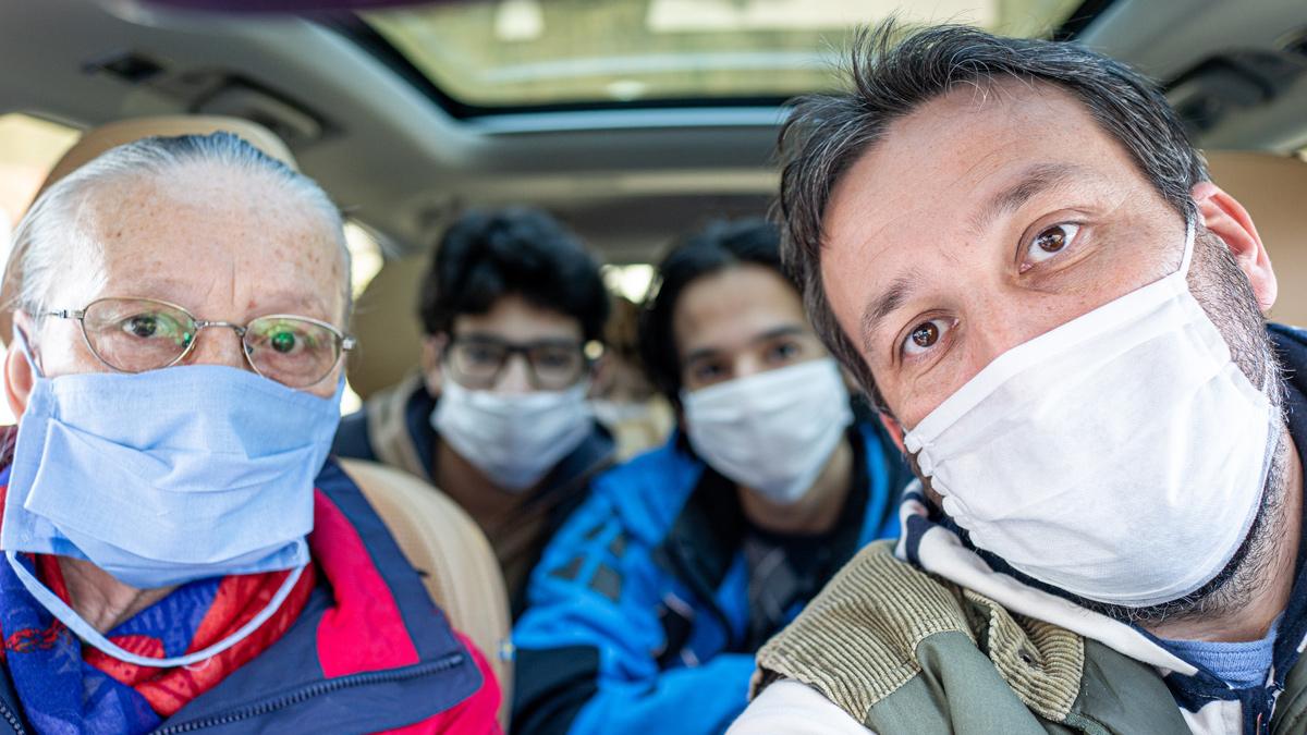 Three generations of a family in a car