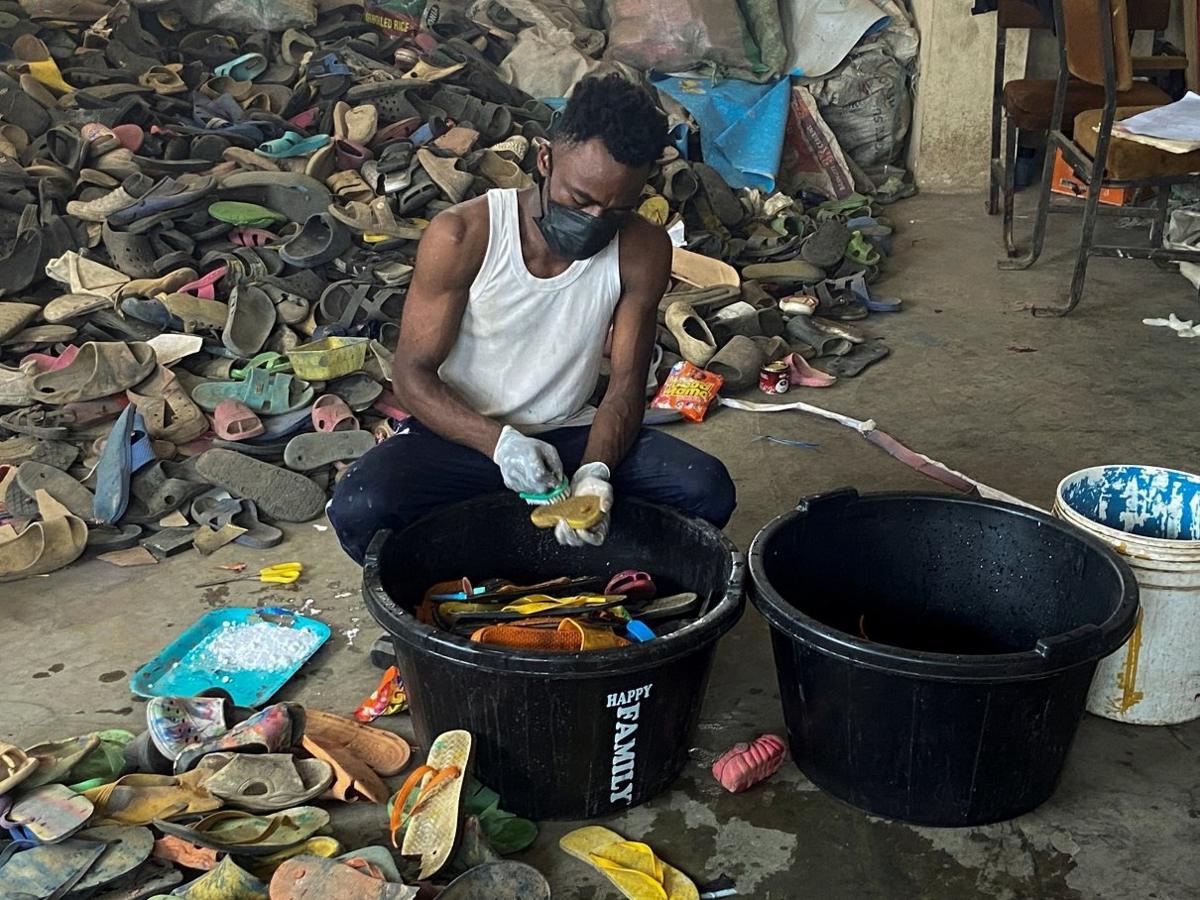 man-cleaning-flipflop-sandals.