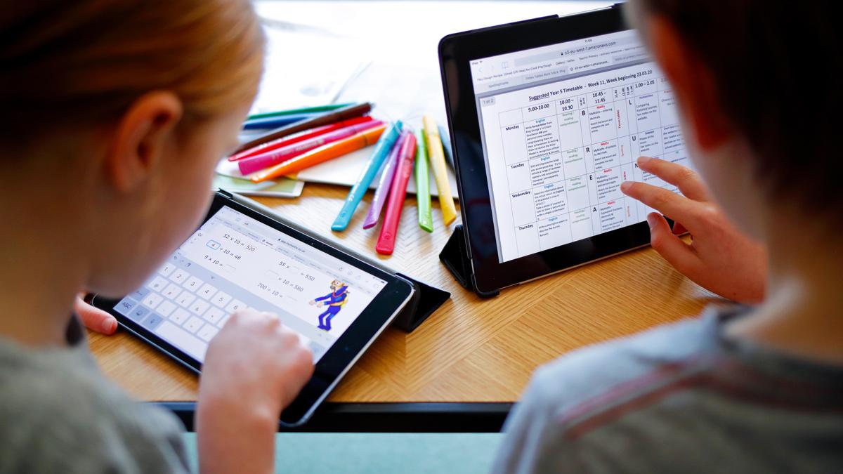 Children using tablets for education