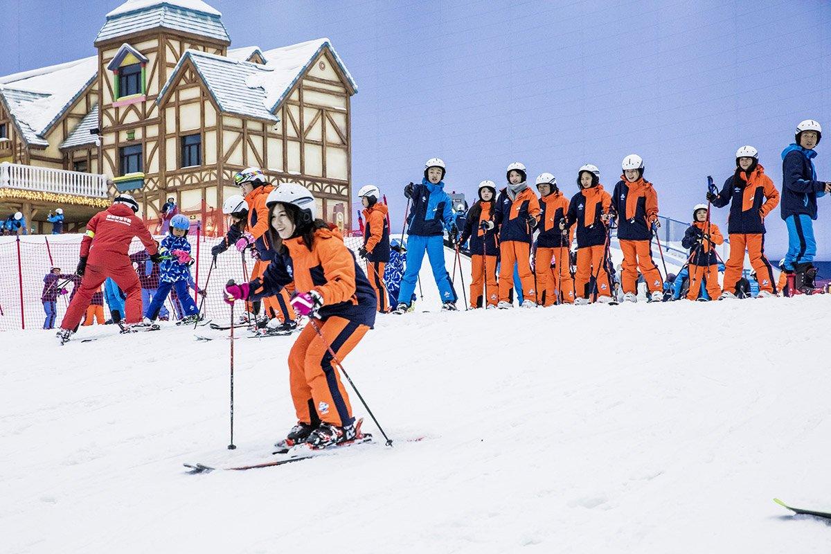 Beginners slope with painting mountain scenery and it’s fake chalet