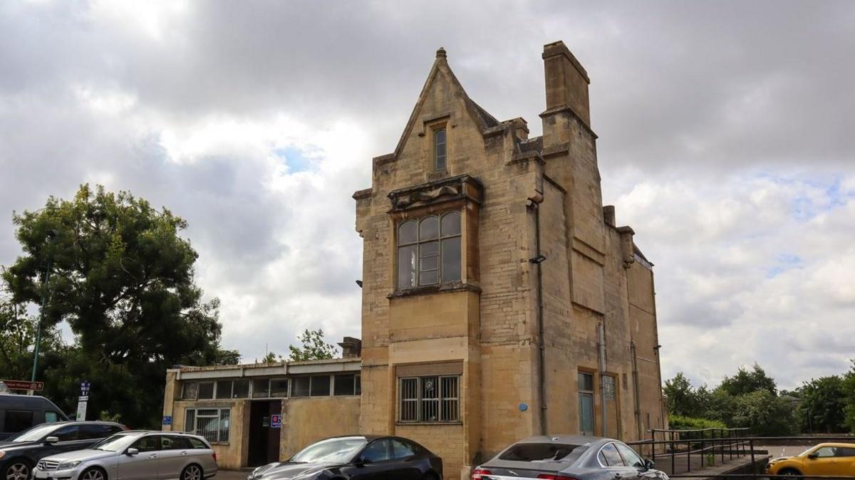 The Old Station in Cirencester with cars parked at the front