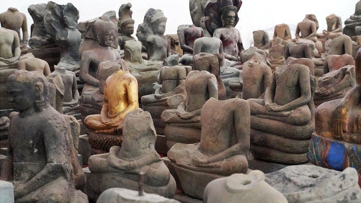 Statues placed in a warehouse near Angkor Wat for protection from looters