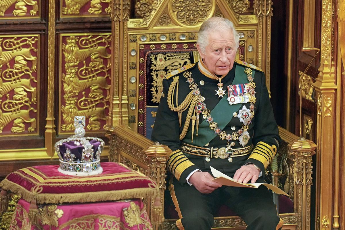 Prince of Wales sitting next to the Imperial State Crown during the State Opening of Parliament - as he delivered the Queen's Speech on behalf of his mother for the first time, May 2022