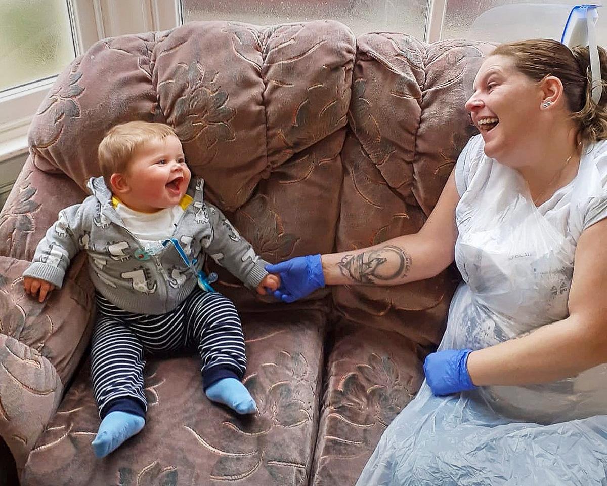 Laura with Leiland-James in the contact centre