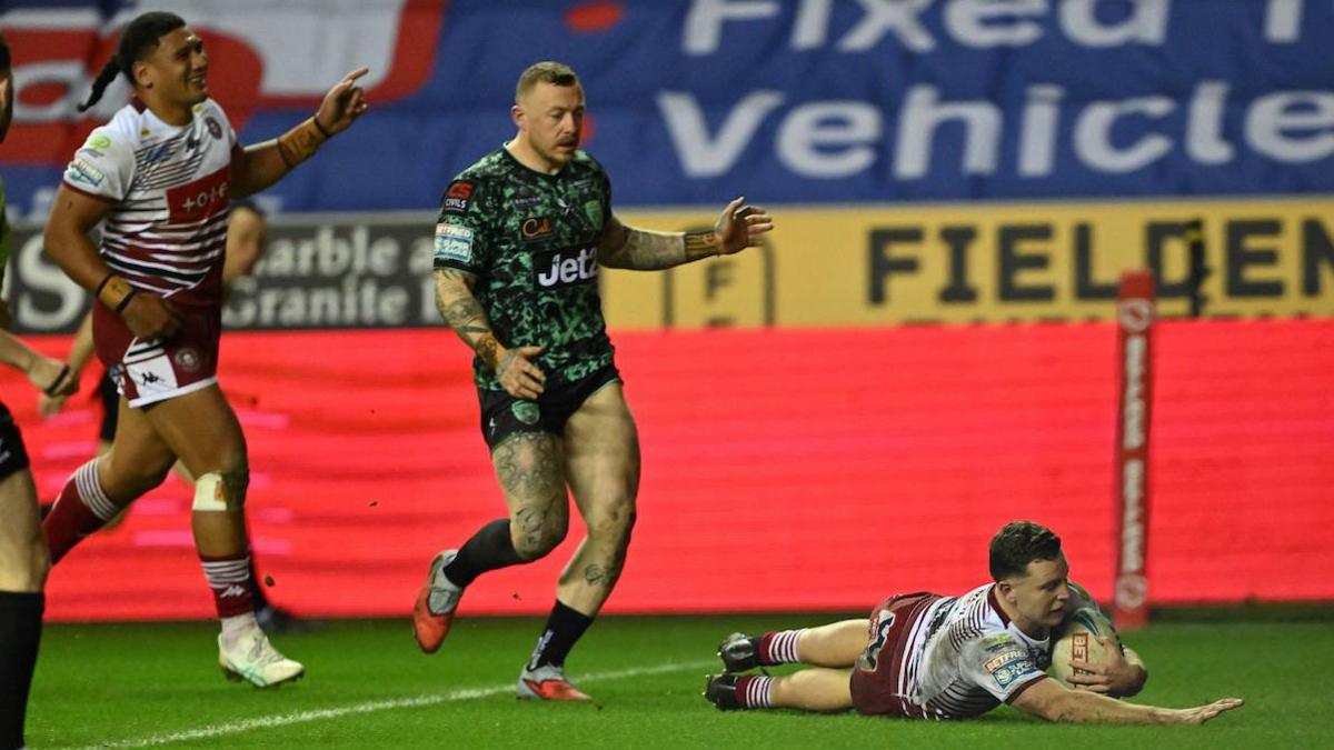 Wigan's Jai Field diving to score against Leigh