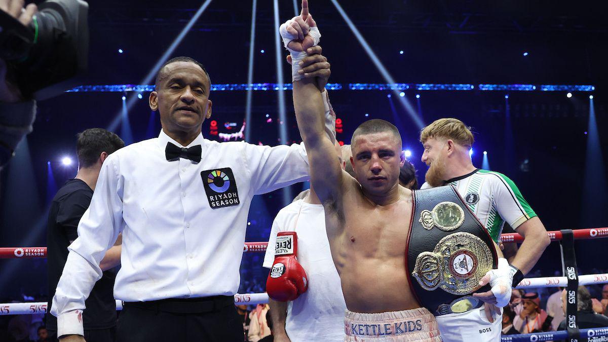 Nick Ball with his arm raised after becoming champion