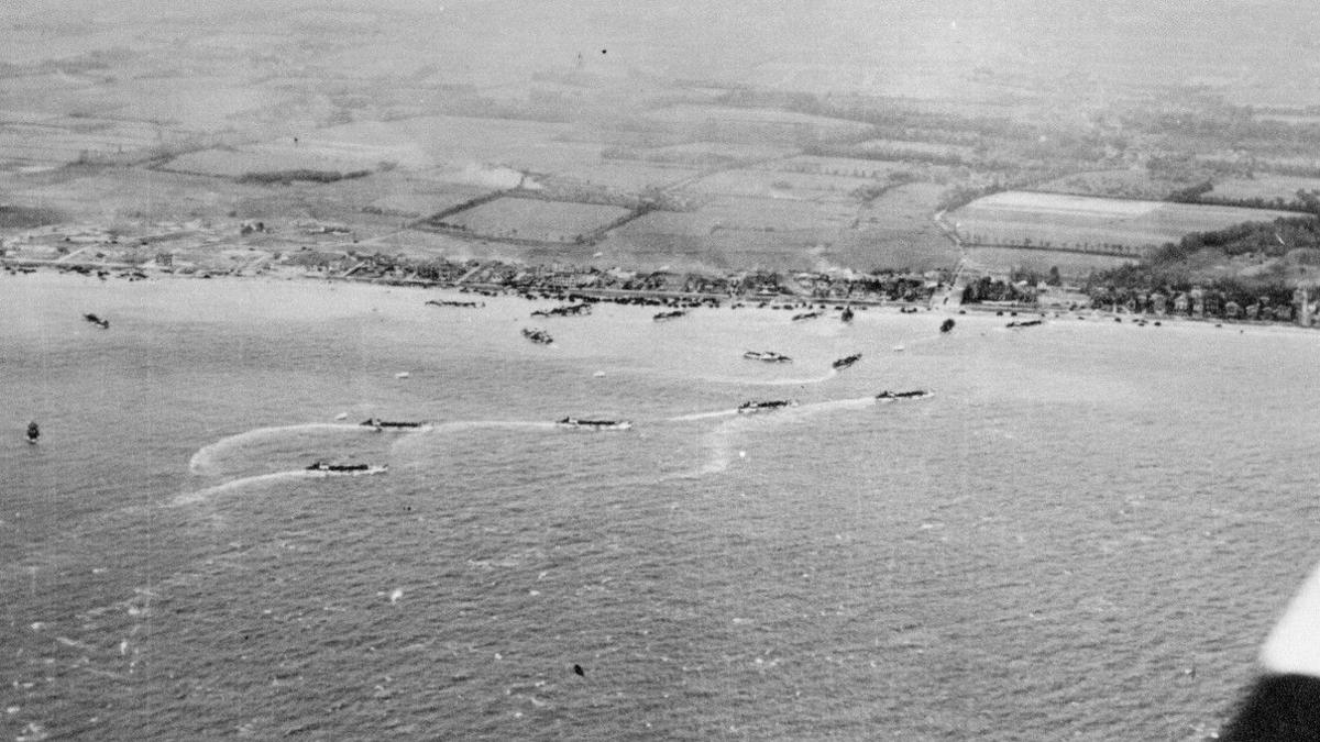 D-Day Landings aerial view on Normandy Beach showing boats in the water and troops on the coastline
