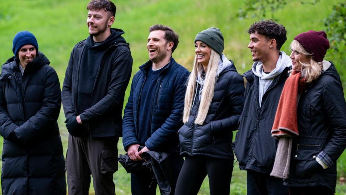 Five of the contestants about to do a task