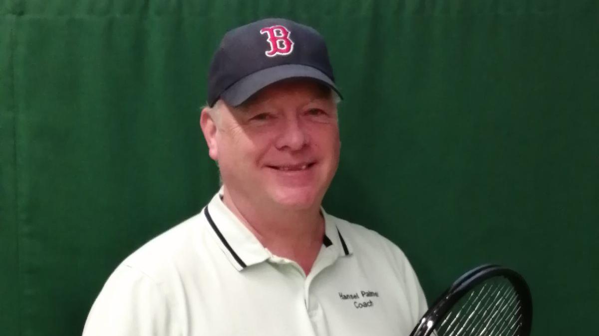 A photo of Hansel Palmer, a friend of tennis player Dan Evans, smiling and holding a tennis racket