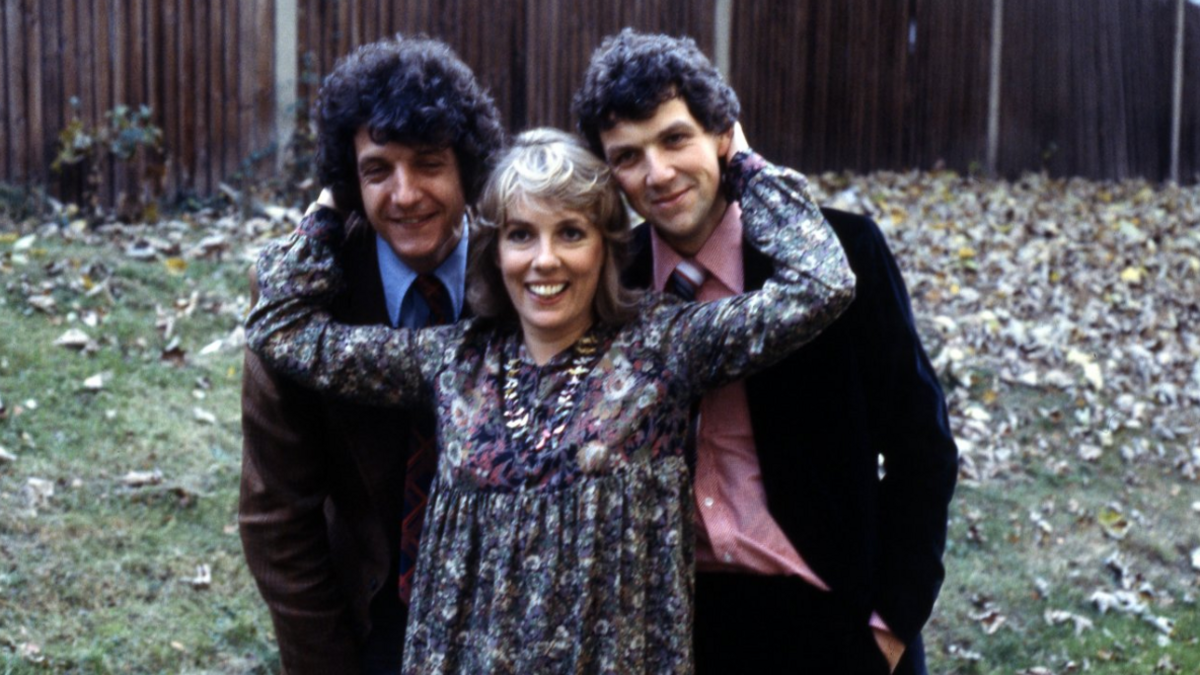 Chris Serle, and Paul Heiney being hugged by Esther Rantzen in a garden in 1979