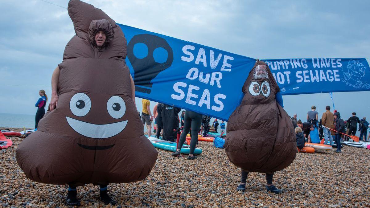 Sewage protests on a beach in East Sussex