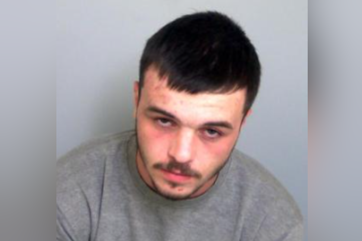 Connor Knight in a grey custody jumper, with short dark hair